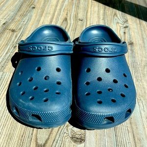 New, very lightly worn navy crocs.